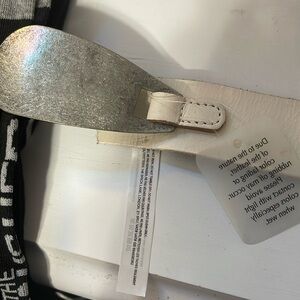 Silver Metal Shoehorn shape with Free People crème Leather Belt